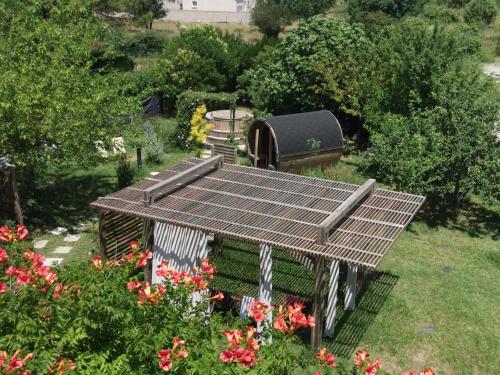 an overhead view of a bird house in a garden at Gite neuf avec accès sauna, bain a remous in Crespian