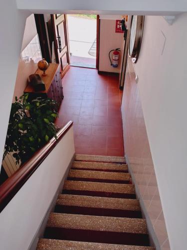 a staircase leading up to a room with a hallway at Casa MARIO y MARIOLA in El Dueso