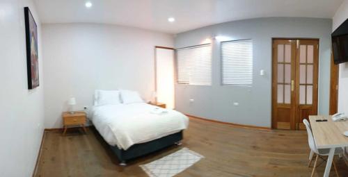 Una cama o camas en una habitación de Hotel Aural