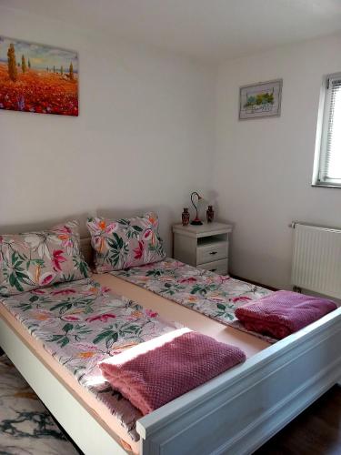 Postel nebo postele na pokoji v ubytování Apartman Leon