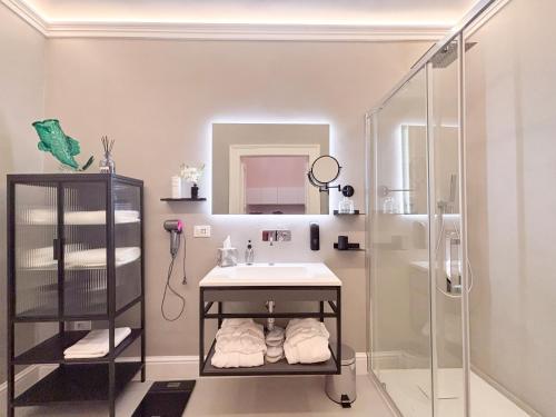 a bathroom with a sink and a shower at Luxury Suite - Free WifI - Smart Tv - centro Storico in Mesagne