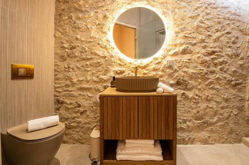 a bathroom with a sink and a mirror at Madonna del Mare City in Chania Town