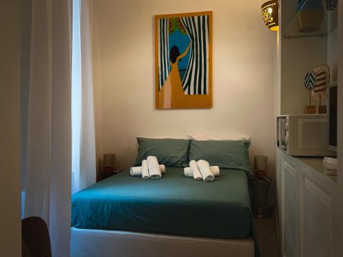 a bedroom with a bed with two towels on it at Casa Tia in Lecce