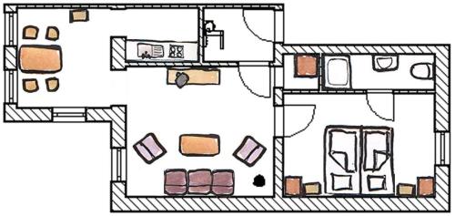 a floor plan of a small house with at Villa Rosenhof in Norderney