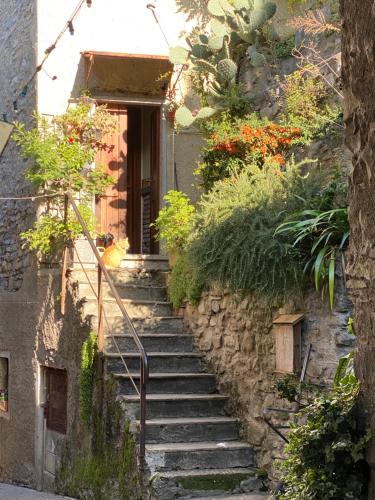 a set of stairs leading up to a door at Romantic Room AL RIFUGIO DEI SOGNI terrazza con vista lago mozzafiato in Blevio