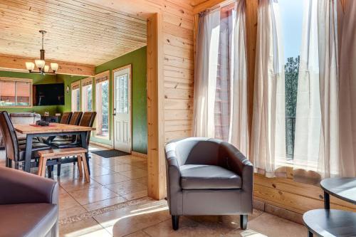 a living room with a chair and a table at 8 Mi to Staunton State Park Mtn-View Hideaway! in Conifer