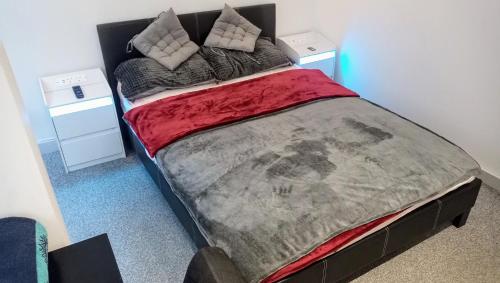 a bedroom with a large bed with two pillows at GORGEOUS FlatD Central London Liverpool St Station in London