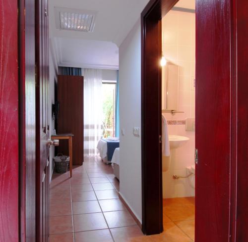 a room with a bathroom with a sink and a toilet at Villa Danlin Hotel in Göcek