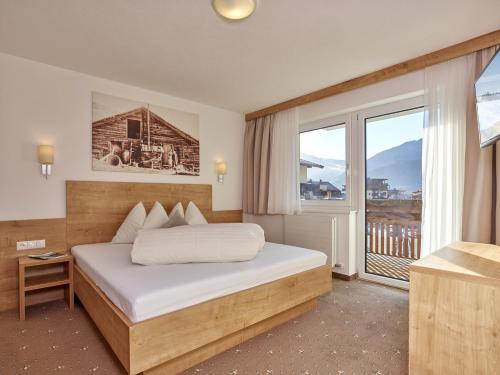 Postel nebo postele na pokoji v ubytování Appartement Gästehaus Bergkristall