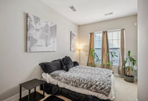 a bedroom with a bed with a teddy bear on it at Luxurious 4BR home with patio and parking x Fits 8 to 10 in Washington
