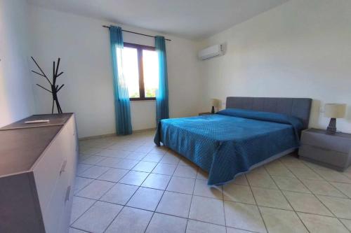 En eller flere senge i et værelse på Villa Rosalia