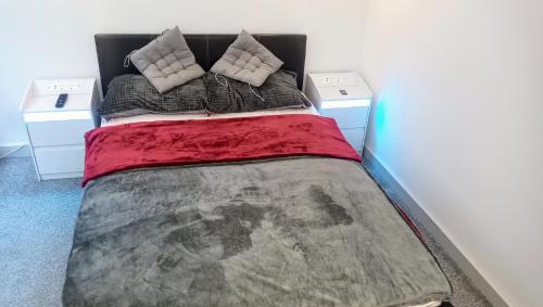 a bedroom with a bed with two pillows at GORGEOUS FlatE Central London Liverpool St Station in London