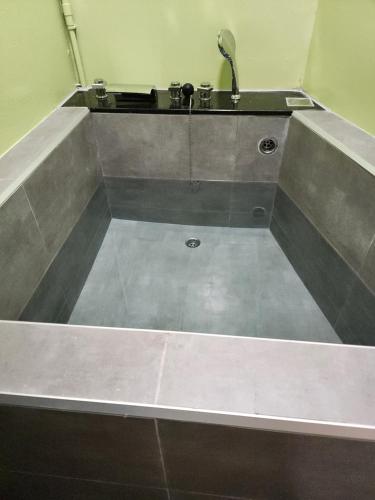 a bathroom with a sink and a sink at 別有洞天電梯包棟民宿漢北館 in Taitung City