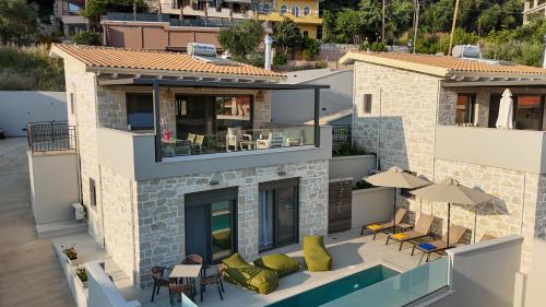 an aerial view of a house with a swimming pool at Villa Maraboo in Parga