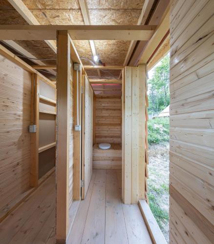 an inside view of a sauna with a toilet at Cioclovina Tribe in Cioclovina