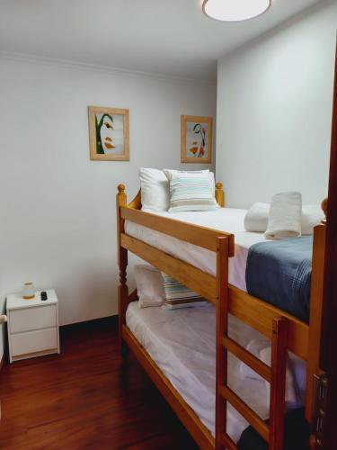 a bedroom with two bunk beds in a room at Casa MARIO y MARIOLA in El Dueso