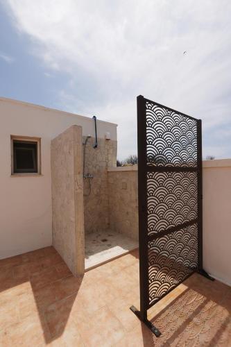 a bathroom with a shower on a roof at AcquaChiara in San Pietro in Bevagna