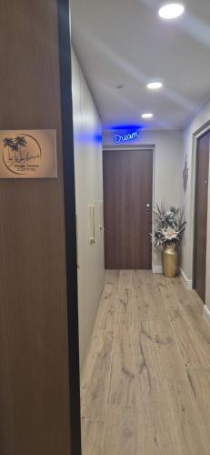 an office hallway with a door with a sign on it at Dream Apartments alloggio turistico in Civitavecchia