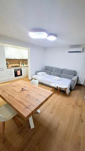 a living room with a couch and a wooden table at La Casina Allegra in La Spezia