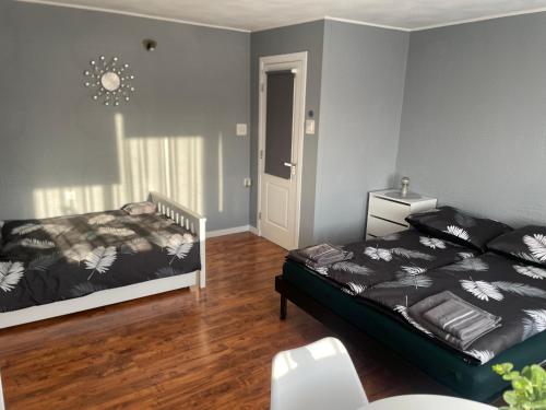 a bedroom with a bed and a dresser in it at Pension u Danuśki z Bogdańca in Lubawka