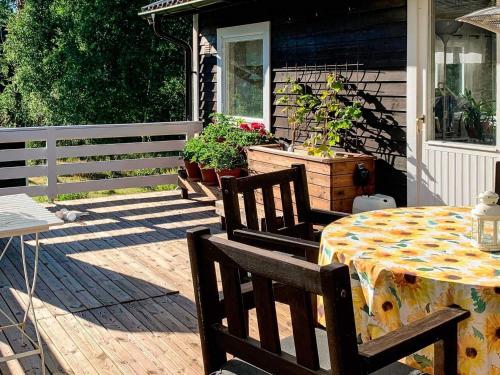 a patio with a table and chairs on a house at 8 person holiday home in Ärla in Malmköping