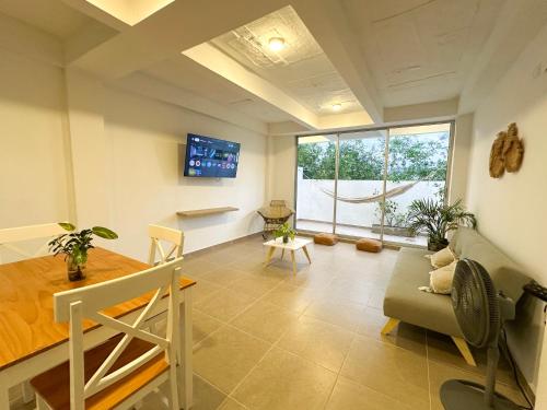 a living room with a couch and a window at Apartment for 4 Guests in Sabanilla a few steps from the sea in Maizal