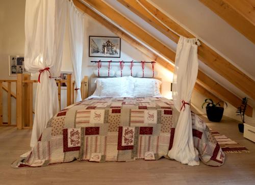 a bedroom with a large bed in a attic at Apartment Mishel in Dubrovnik
