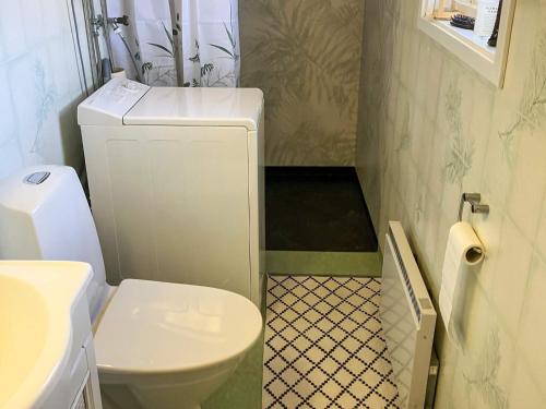 a small bathroom with a toilet and a sink at 6 person holiday home in SUNNE-By Traum in Sunne