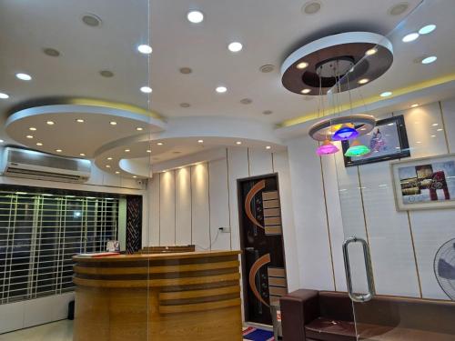 a lobby with a bar in a building at Hotel Nagar in Khulna