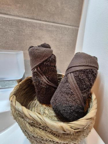 a basket with two socks sitting on a sink at Vai'ei Nui Home in Papeete