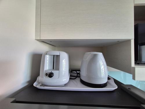 a white appliance sitting on top of a counter at Vai'ei Nui Home in Papeete
