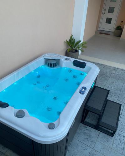 a jacuzzi tub sitting in a room at Merelia Luxury Guesthouse in Haraki