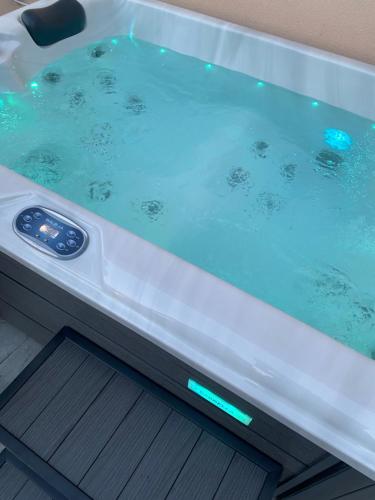 a jacuzzi tub with a thermometer in it at Merelia Luxury Guesthouse in Haraki