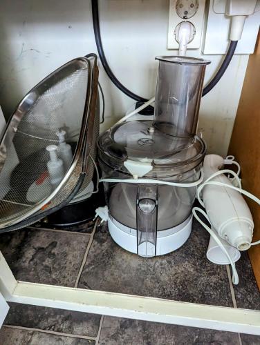 a blender sitting on top of a kitchen counter at Boats stay play lake cabin in Broby