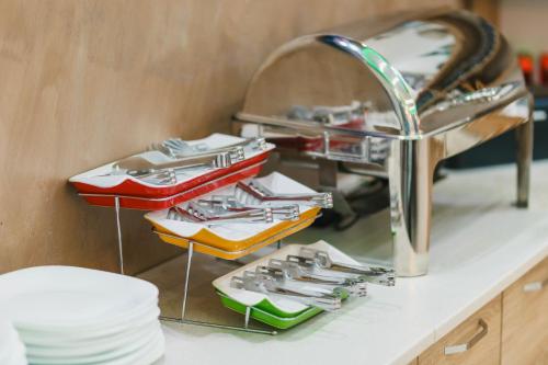 a kitchen counter with a sink and a sink at Apart-Hotel President in Ulcinj