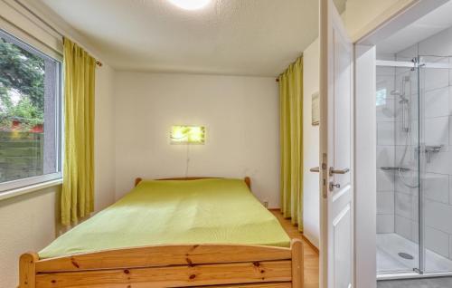 Ένα ή περισσότερα κρεβάτια σε δωμάτιο στο Ferienhaus Dranske Nonnevitz