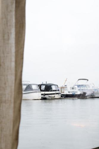 a group of boats docked in a harbor at RetreatBoat Ibiza in Lith