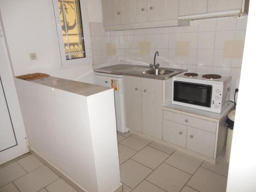 Kuchyň nebo kuchyňský kout v ubytování Helonata Apartments