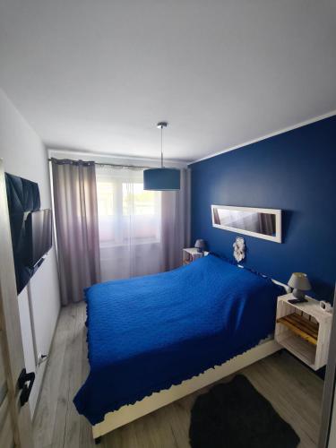 Ένα ή περισσότερα κρεβάτια σε δωμάτιο στο Kiepury