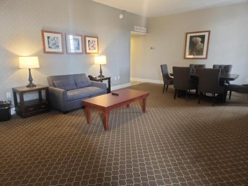 a living room with a couch and a table at Natural Bridge Hotel, Trademark Collection by Wyndham in Natural Bridge