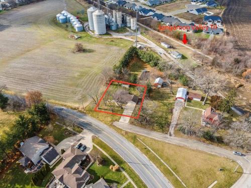 an aerial view of a yard with houses and a road at The Archer Home in Springfield