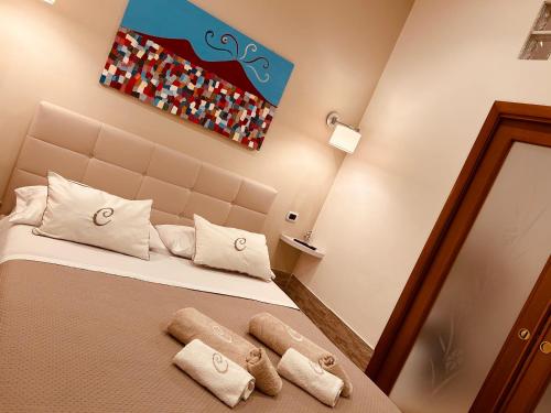 Ένα ή περισσότερα κρεβάτια σε δωμάτιο στο Il tempo di un Caffè