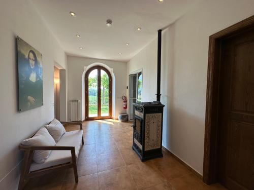 a living room with a stove in the middle of a room at Villa La Gioconda in Arezzo
