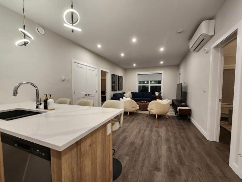 a kitchen with a counter and a living room at Riverstone Retreat in Golden BC in Golden