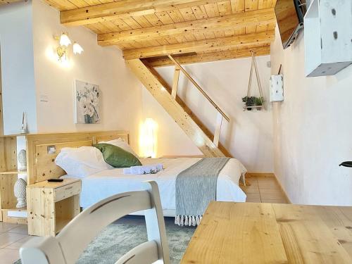 a bedroom with a bed and a staircase at Masseria Paretano in Santa Lucia