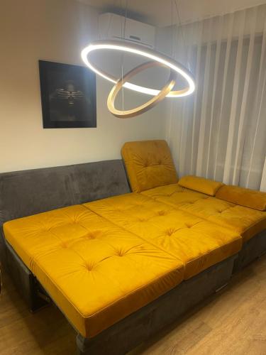 a large bed in a room with a light at Premier Fort Beach-Luxury Studio-First Line Resort in Sveti Vlas