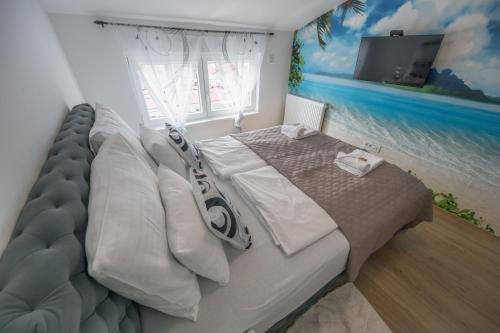 Postel nebo postele na pokoji v ubytování Apartman TRI KRALJA 1