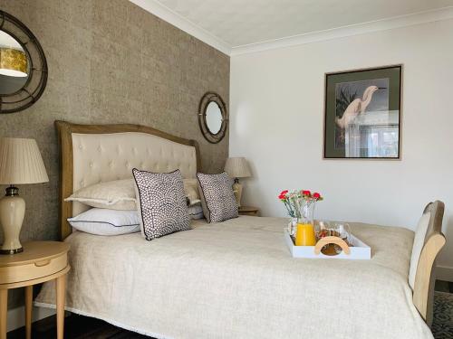 En eller flere senge i et værelse på Shona Retreat - Caister