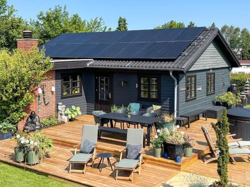 a house with solar panels on its deck at 8 person holiday home in Gilleleje-By Traum in Gilleleje