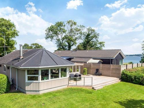 a home with a deck and a house at 6 person holiday home in Aabenraa-By Traum in Aabenraa